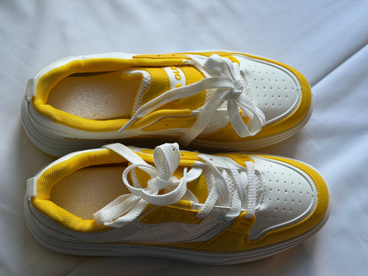 Men’s yellow and white casual shoes
