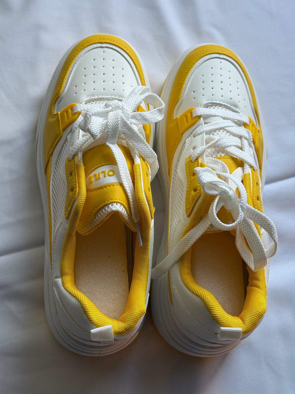 Men’s yellow and white casual shoes