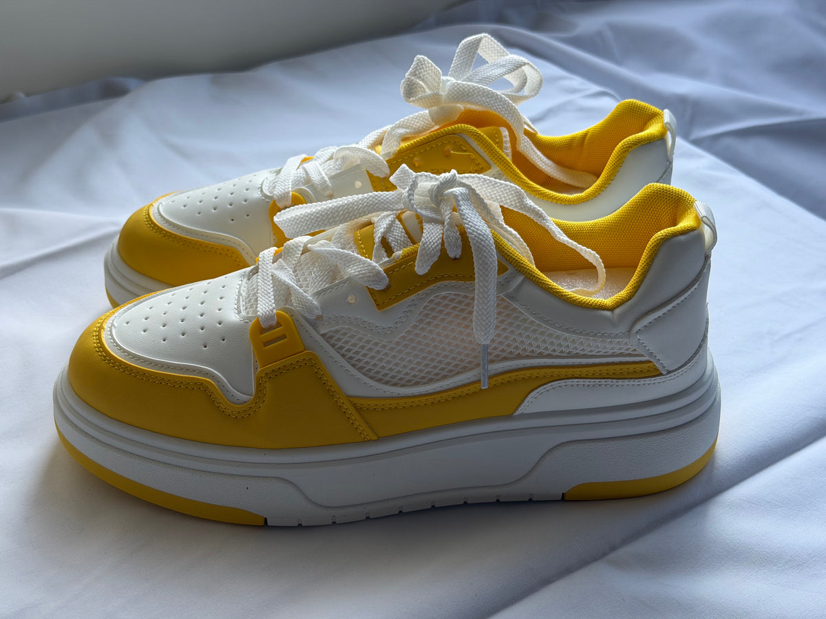Men’s yellow and white casual shoes