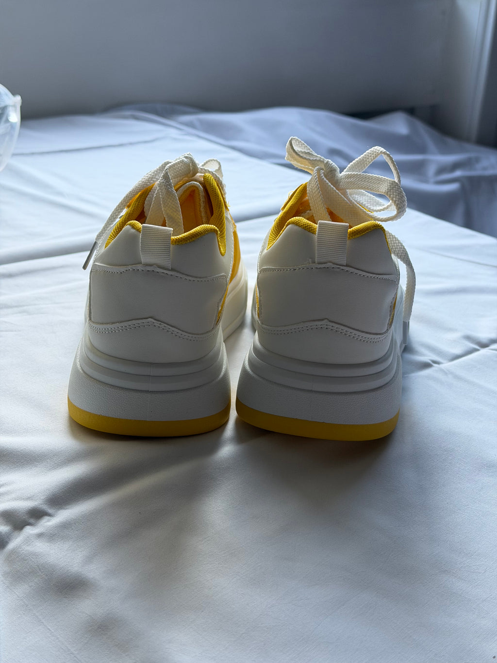 Men’s yellow and white casual shoes