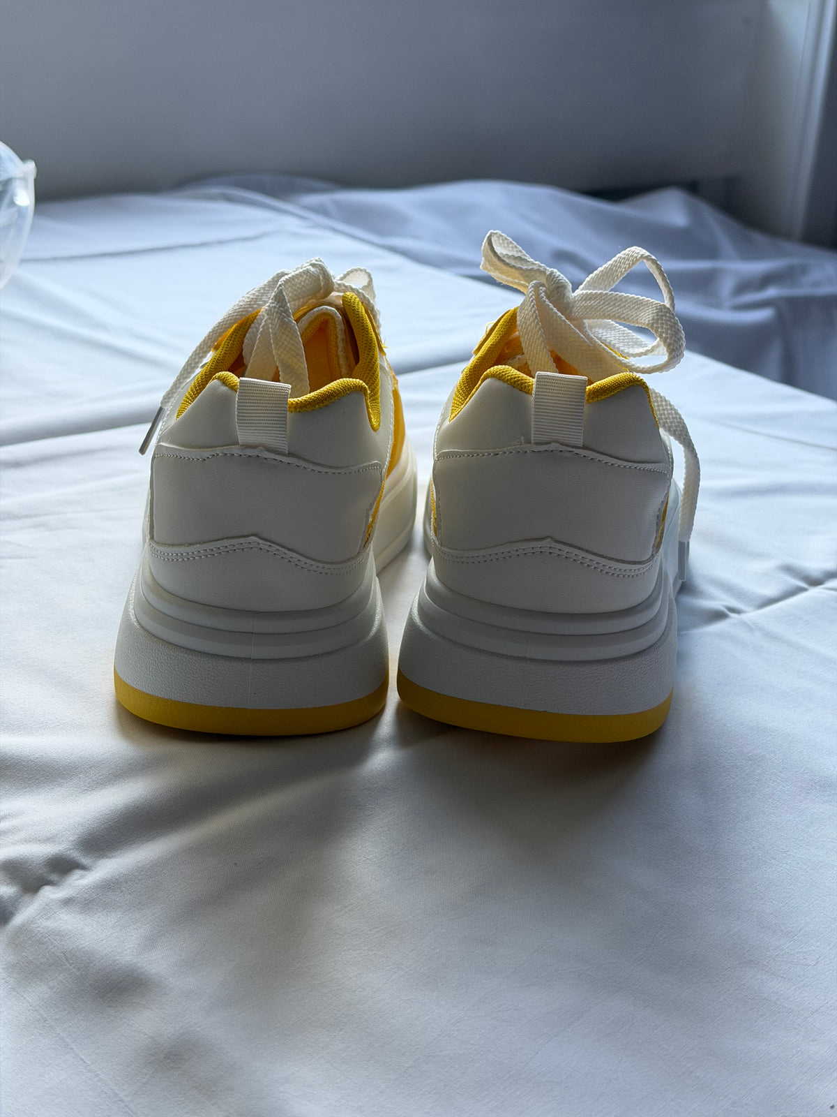 Men’s yellow and white casual shoes